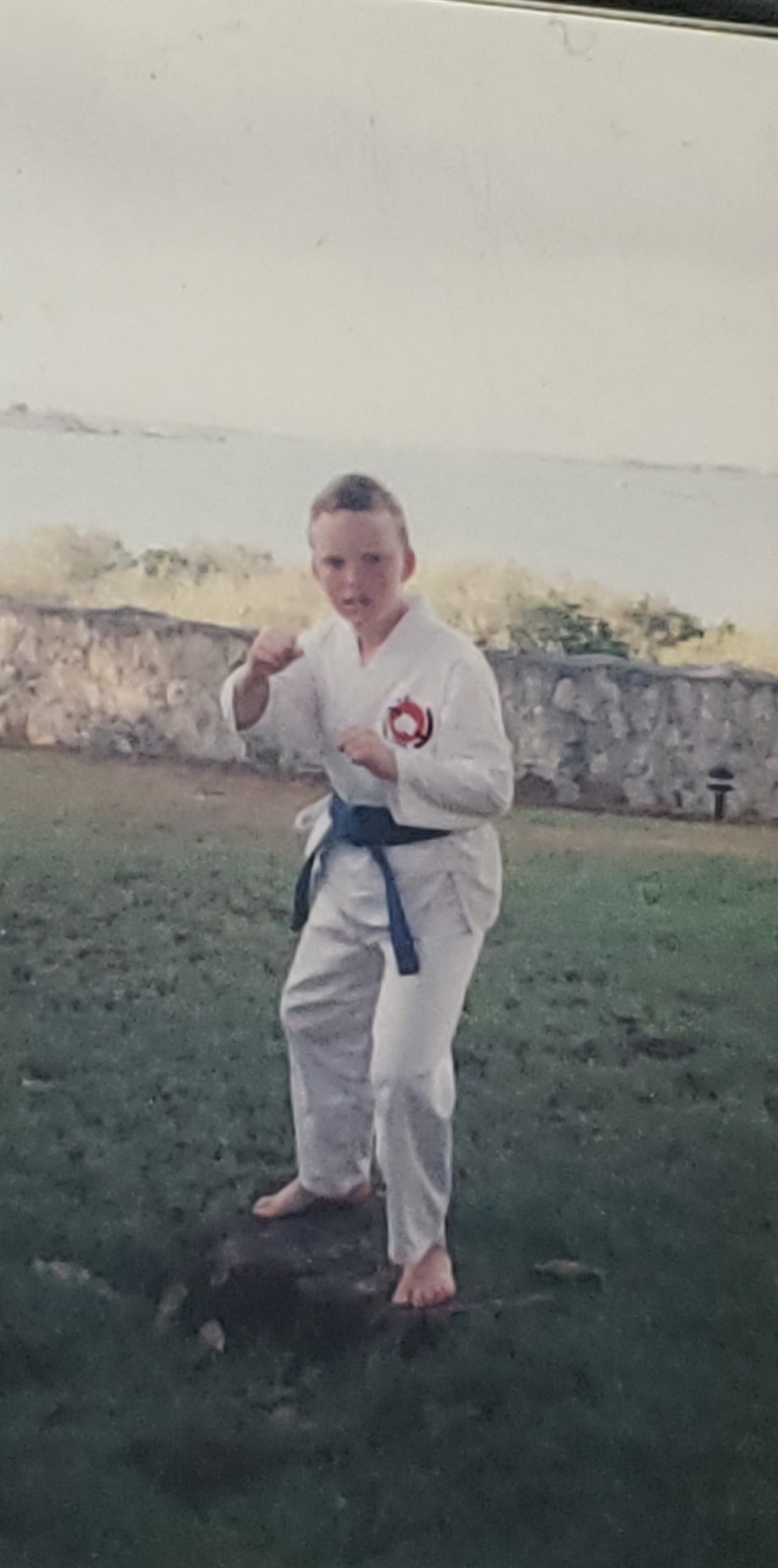 A young Sean O'Hara in a karate gi with blue belt